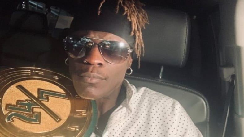 R-Truth with the 24/7 Championship
