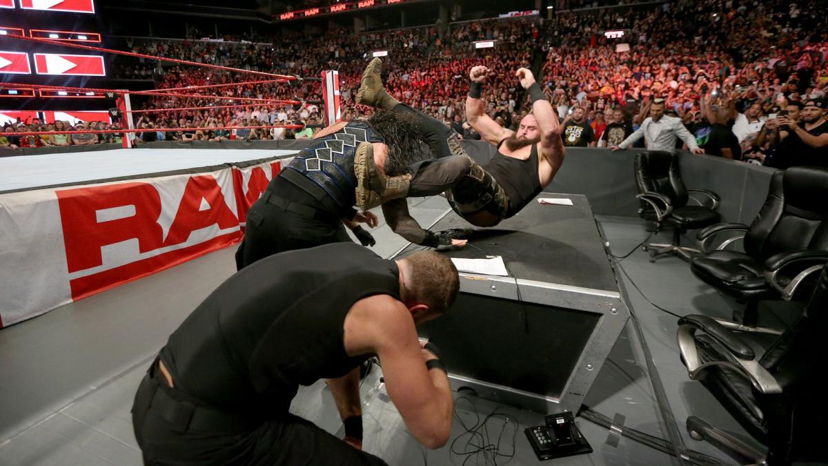 The Shield Triple Powerbomb Strowman through the table!